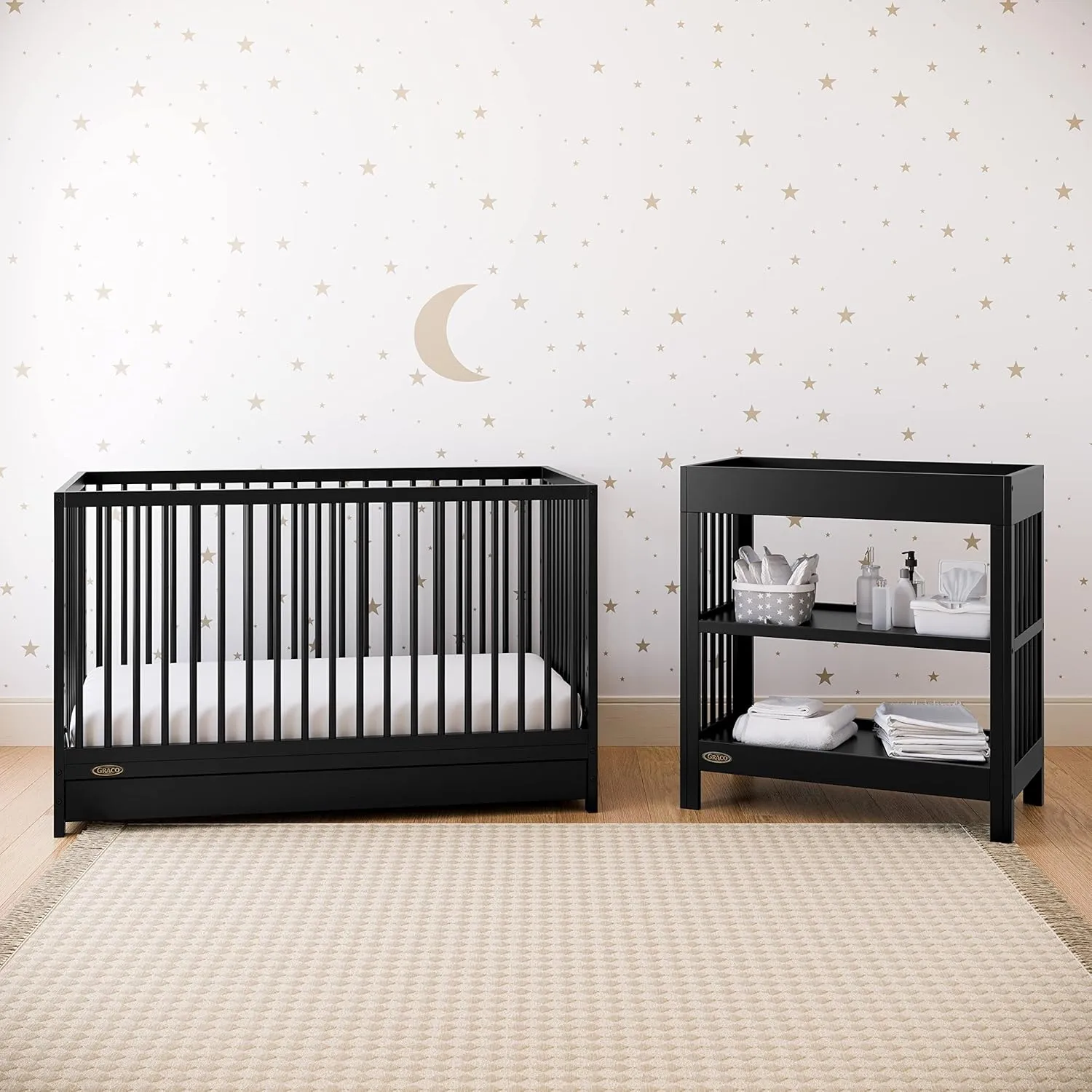Graco Teddi Changing Table with Water-Resistant Changing Pad (Black) - GREENGUARD Gold Certified, Includes Bonus Water-Resistant Changing Pad with Safety Strap, 2 Shelves, Easy-to-Match